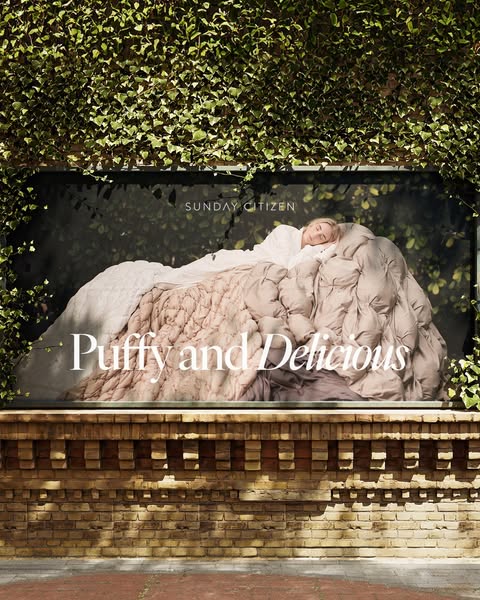 This ad for Sunday Citizen features a woman sleeping comfortably beneath a lush, puffy comforter. The image is displayed