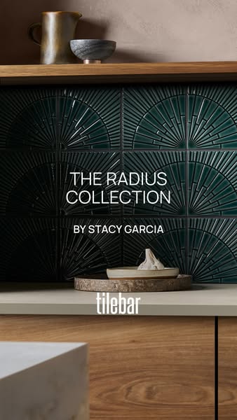 This image ad showcases The Radius Collection of tiles by Stacy Garcia, presenting an art deco-inspired, modern interior