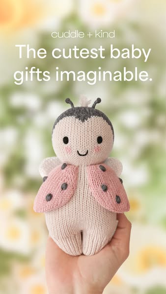 This ad features the brand Cuddle + Kind and promotes their line of baby gifts with an image of a knitted ladybug doll.