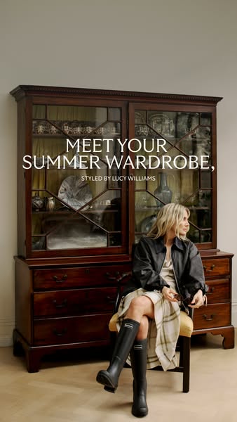 An image ad shows a woman seated on a chair next to a dresser, in a dress, jacket, and rain boots. The ad headline is &q