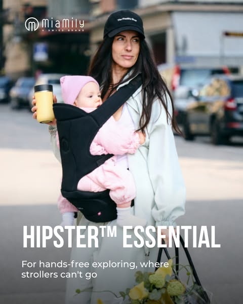 This image ad showcases the Miamily HIPSTER™ Essential baby carrier in an urban setting. It features a stylish mother ca
