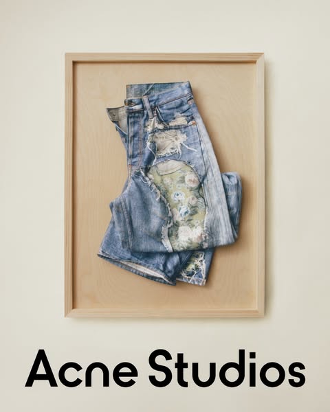 Image ad for Acne Studios featuring artfully distressed denim shorts.