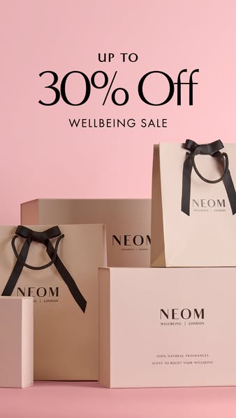 This is a still image ad promoting a sale on NEOM Wellbeing products. The ad features the brand's shopping bags and 