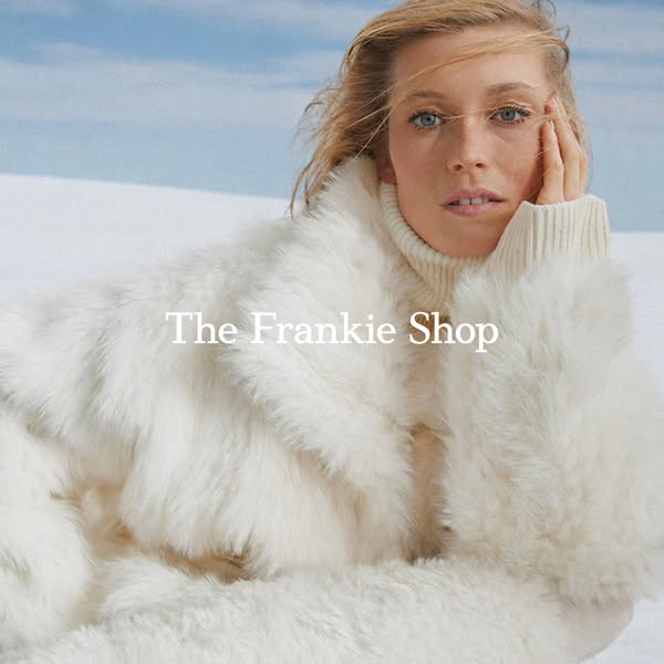 This ad features a woman wearing a white coat from The Frankie Shop. The brand logo is displayed in the center of the ad