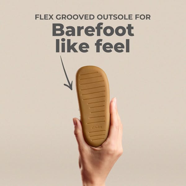 This ad highlights the flex grooved outsole feature of Clarks footwear, emphasizing a 'barefoot like feel'. The 