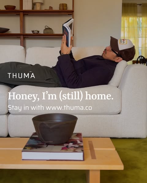 An image ad for Thuma featuring a man relaxing at home on their couch.
