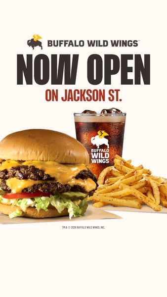This image ad for Buffalo Wild Wings announces the opening of a new location on Jackson Street. It features a close-up o