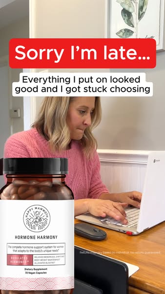 A woman is working on her laptop and indicates that she is late because she was having trouble choosing an outfit. The p