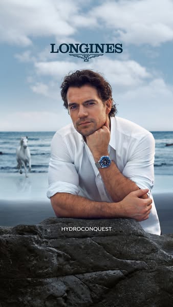 This image ad showcases Henry Cavill on a beach while wearing a Longines Hydroconquest watch. The ad is designed to port