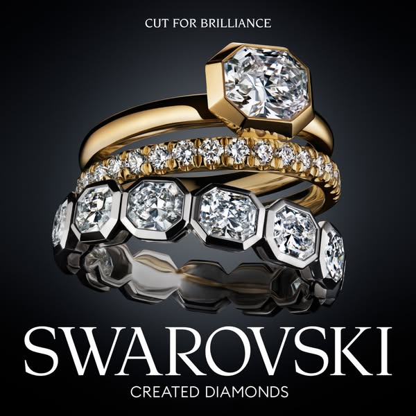 This image ad by Swarovski promotes their created diamonds through a close-up shot of three stacked rings. The focal poi
