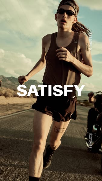 This ad features a runner on a desert road wearing Satisfy brand athletic wear. The ad focuses on the clothing being ide