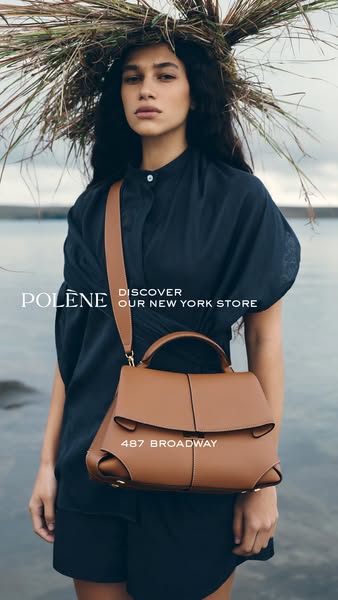 This ad for Polène features a woman wearing a dark blue dress and a headpiece made of dried grass, standing on what appe