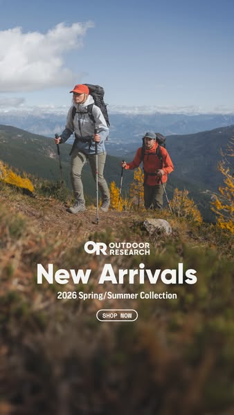 An ad for Outdoor Research clothing and gear featuring two people hiking in the mountains.