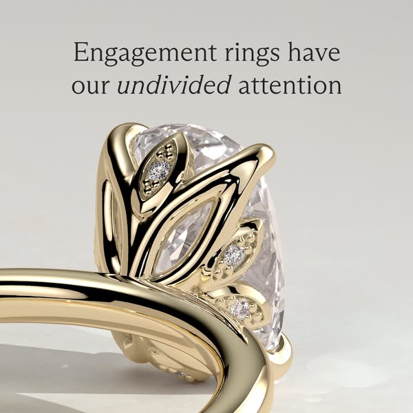 The ad features a detailed close-up of a gold engagement ring, emphasizing its intricate design and the sparkle of the d