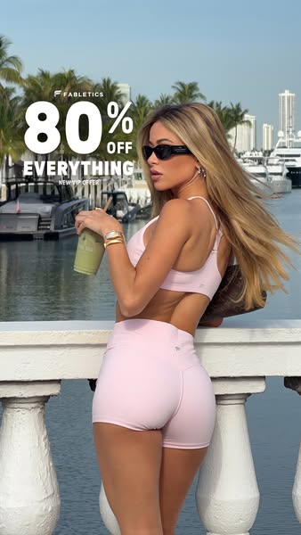 This Fabletics ad features a young woman in a matching pink activewear set promoting an 80% off sale. The ad is targeted