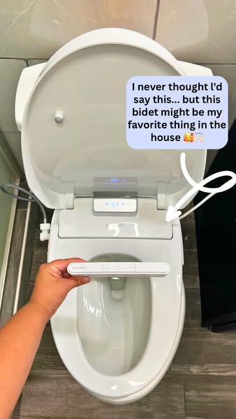 A photo that looks like it could have been taken with a phone, featuring a user endorsing a bidet, stating it's thei