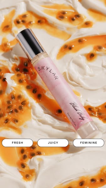 This ad highlights the Skylar Blush Body Eau de Parfum. The ad features the product bottle over a background of passion