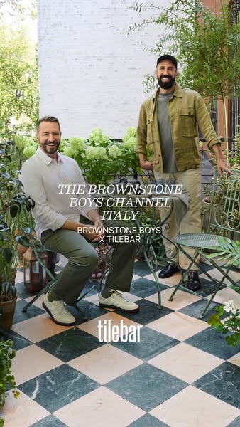 This ad features a photo of the Brownstone Boys, an interior design duo, standing on a Tilebar-designed tile floor. The