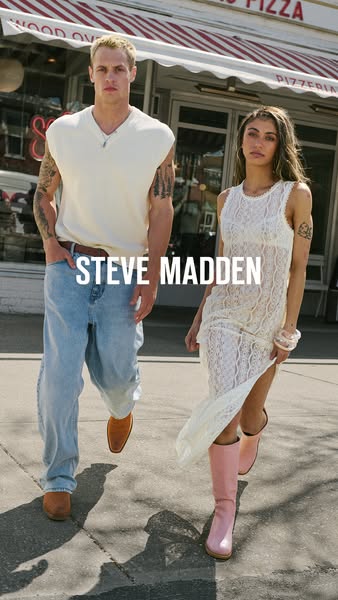 This ad features two models wearing Steve Madden boots while walking down a city street in front of a pizza shop. The St