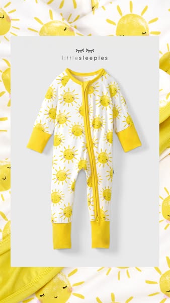 This ad showcases a children's pajama onesie featuring a sun pattern on a white backdrop.