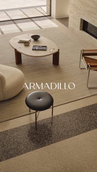 The ad showcases a variety of Armadillo brand home furnishing pieces. The scene is set in a modern home with neutral ton