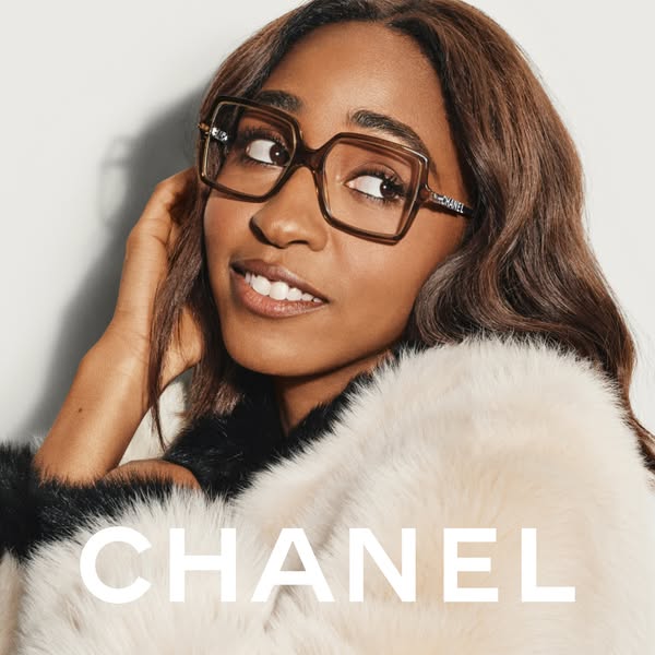 An image ad for Chanel eyewear featuring a woman wearing brown, squared, oversized glasses. The image is cropped to focu
