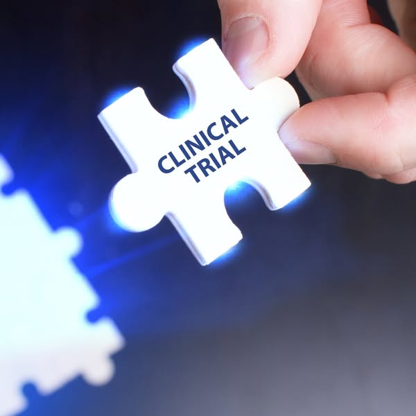 This image ad shows a hand holding a puzzle piece that says "CLINICAL TRIAL" on it, suggesting that the clinic