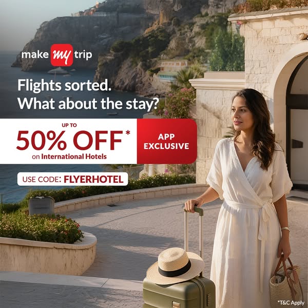 This image ad from MakeMyTrip promotes savings on international hotels for app users. The ad features a woman with lugga