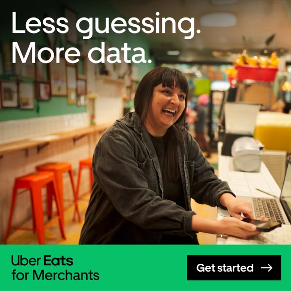 This image ad for Uber Eats for Merchants features a smiling woman in a restaurant setting, aiming to showcase the benef