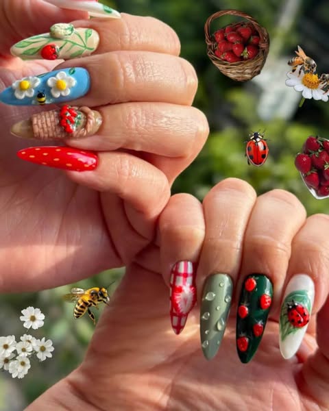 This image features two hands with different and creatively designed strawberry and garden-themed artificial nails. The 