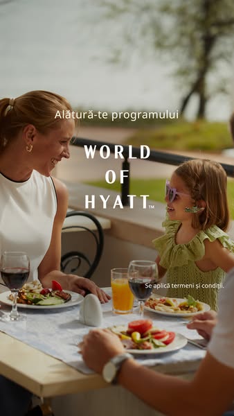 This image ad promotes the World of Hyatt program, showing an idyllic outdoor dining scene with a family enjoying a meal