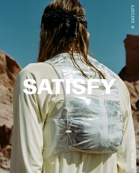 This ad showcases the brand Satisfy and their running vest. It features a photo of a runner wearing the vest, highlighti