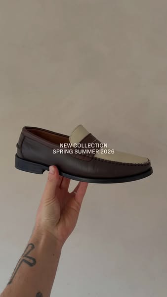 This ad showcases a brown and beige loafer from a new spring/summer collection. The shoe is held up against a neutral ba