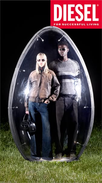 An image ad showcasing two models within a plastic bubble, seemingly promoting a Diesel brand image of 'successful l