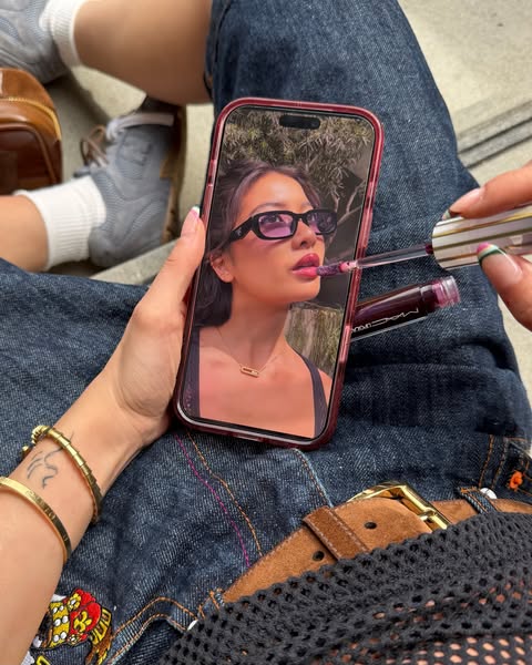 This ad is highlighting a Mac lip product by displaying the product being used over a video of the product being applied