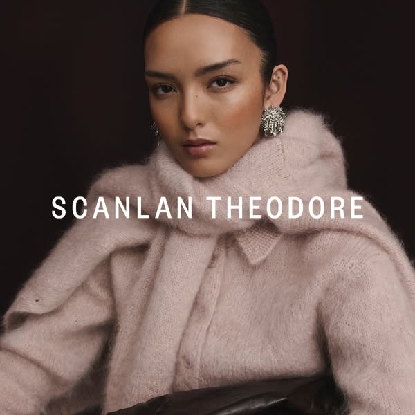 A portrait-style ad for Scanlan Theodore features a woman wearing a light pink knit cardigan and scarf.