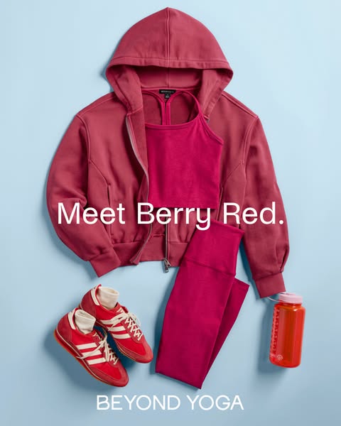This ad showcases Beyond Yoga activewear in a berry red color, presented in a flat lay style.