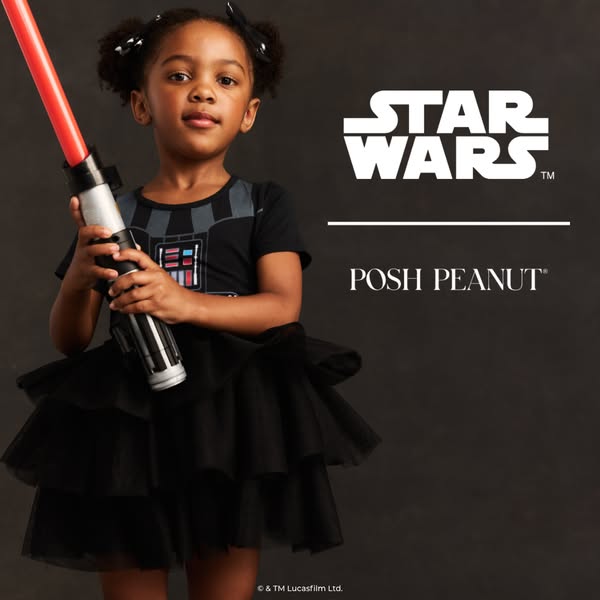 This ad features a young girl dressed in a black dress with the Darth Vader armor design on the chest, along with the St
