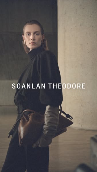 This image ad features a model in a high-fashion outfit carrying a brown leather handbag from Scanlan Theodore. The ad f