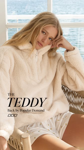 An image ad featuring a woman in a cream-colored teddy quarter-zip pullover, with the text overlay 'THE TEDDY Back b