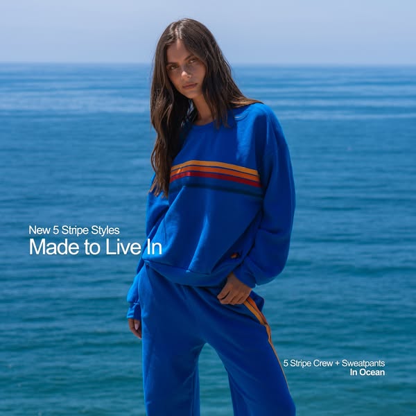 This ad showcases a matching blue crewneck sweatshirt and sweatpants set with orange stripes. The ad aims to convey a re