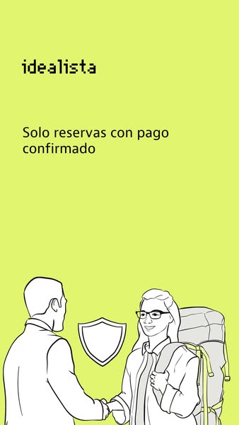 This image ad for Idealista shows an illustration of a handshake between a person and a traveler. The ad is designed to 