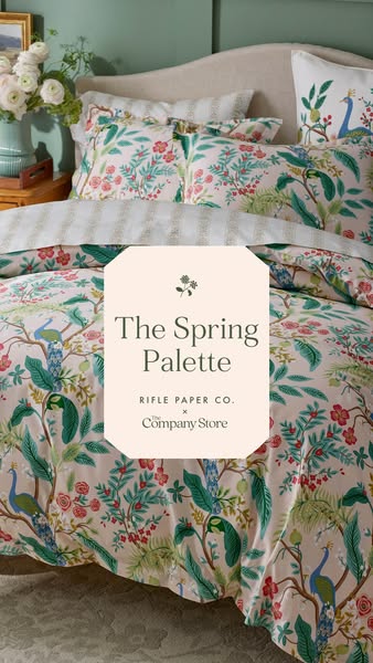 This image ad features a styled bed displaying Rifle Paper Co. x The Company Store bedding. The headline highlights &quo
