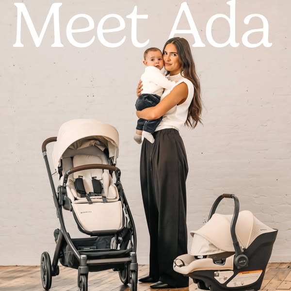 The ad features the UPPAbaby Aria infant car seat and base, along with the UPPAbaby Vista V2 stroller. A woman holds a b
