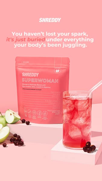 This ad features Shreddy Superwoman powder, a women's wellness blend, presented in a pink themed layout with a glass