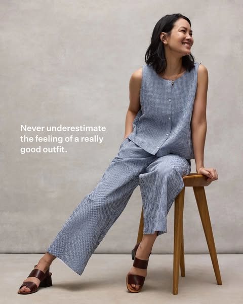 An image ad featuring a woman wearing a blue and white checkered outfit with a headline that reads, "Never underest