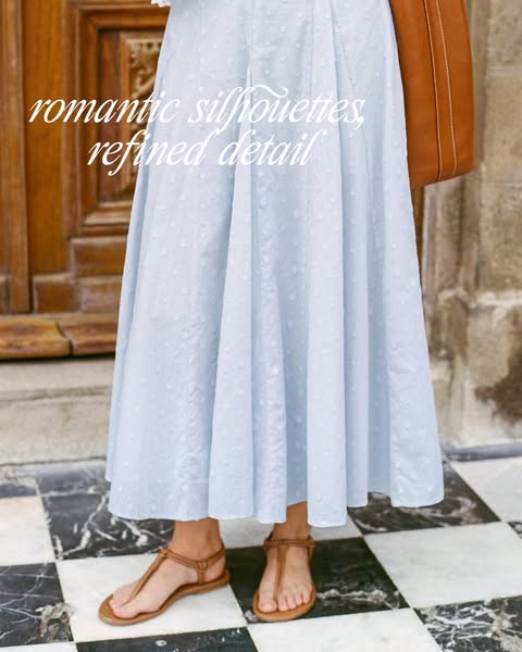 This ad showcases a light blue skirt with white polka dots, promoting romantic silhouettes and refined details. The ad u