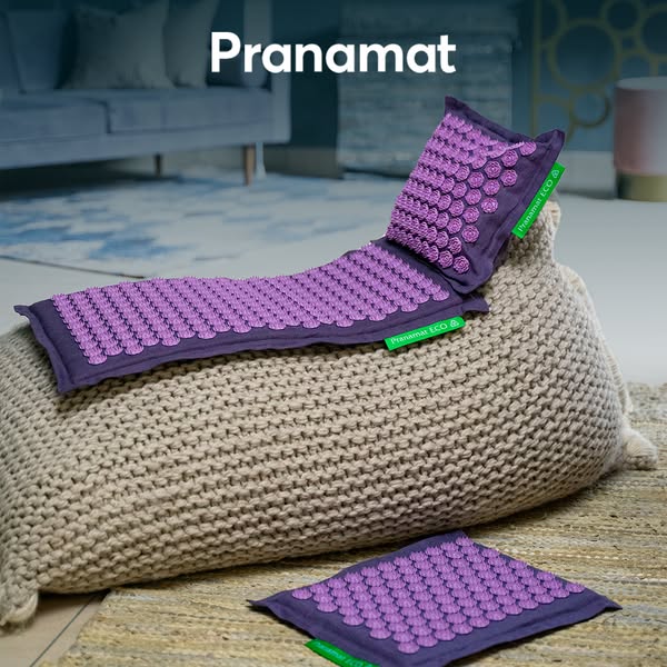 This ad features a Pranamat acupressure mat set. The ad showcases the product on a textured surface, emphasizing its des