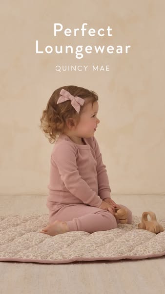 This ad promotes Quincy Mae's line of loungewear for children. The image features a young child wearing the loungewe