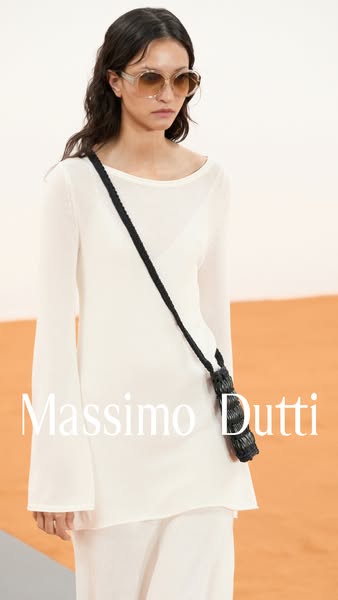 An elegant outdoor fashion ad for Massimo Dutti, featuring a woman wearing white clothing and sunglasses.